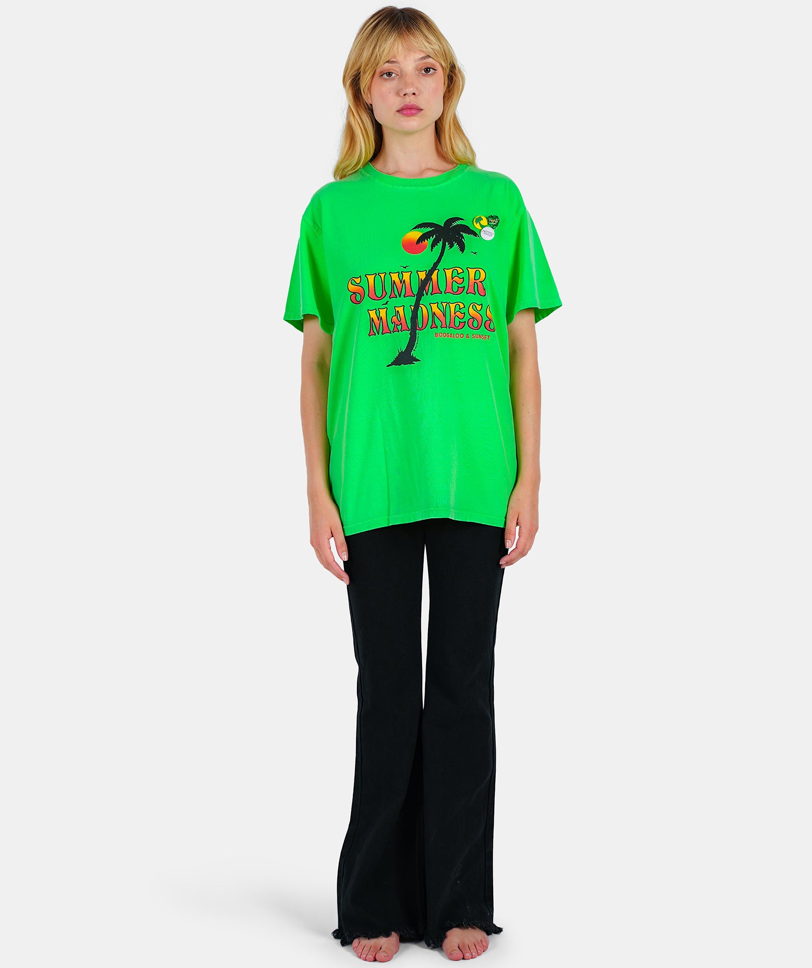 Neon green "MADNESS" trucker tee